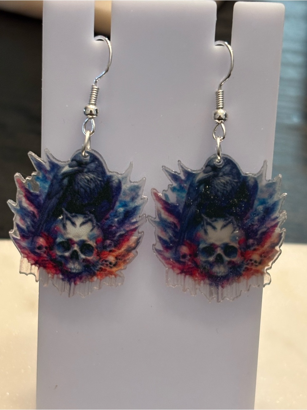 Title: Raven Skull Nebula Acrylic Dangle Earrings | Perched Raven on Skull | Sil